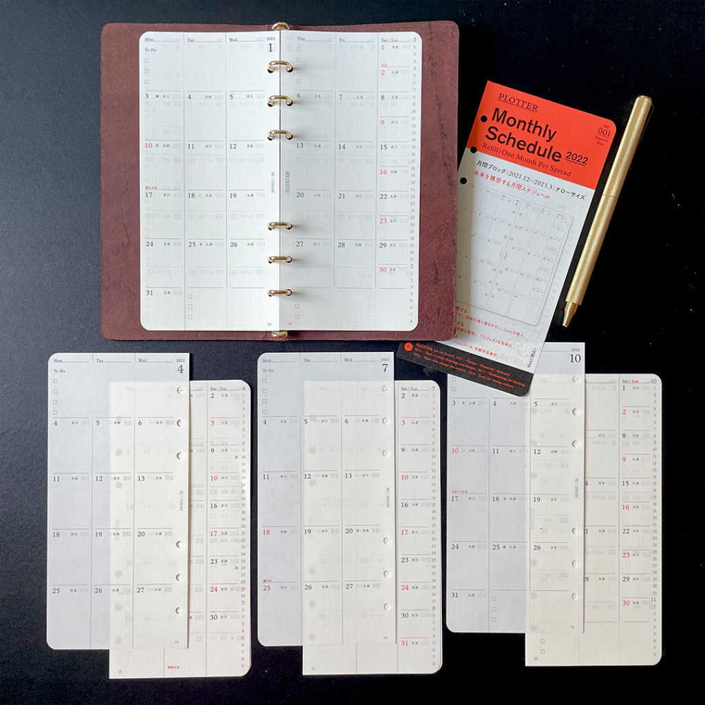 PLOTTER Narrow Leather Binder with monthly calendar refills around it. 