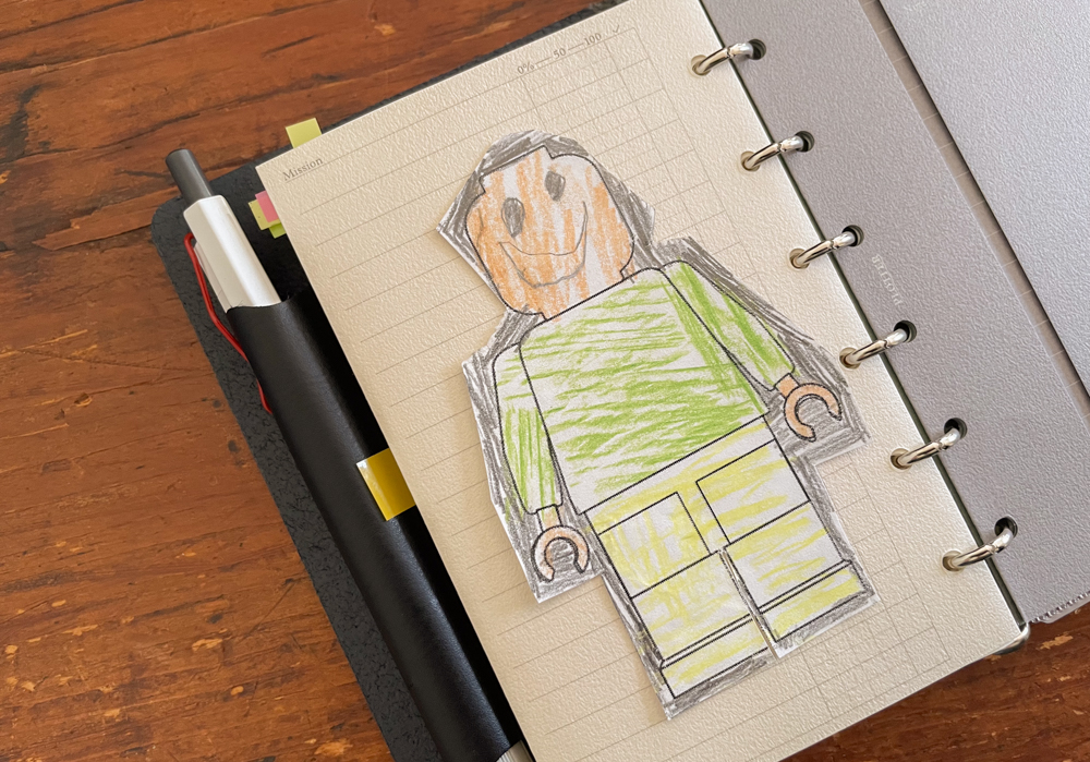 Close-up of lego doodle by a child inside a PLOTTER leather binder Mini Size.