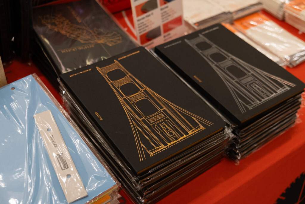 Golden Gate Bridge Notepads in black with copper foiling and holographic foiling.