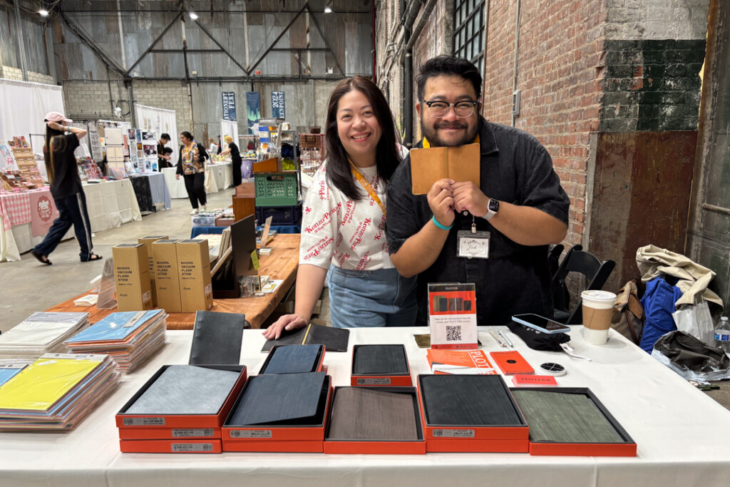 PLOTTER USA booth at Stationery Fest with PLOTTER USA staff holding their PLOTTER Leather Binder.