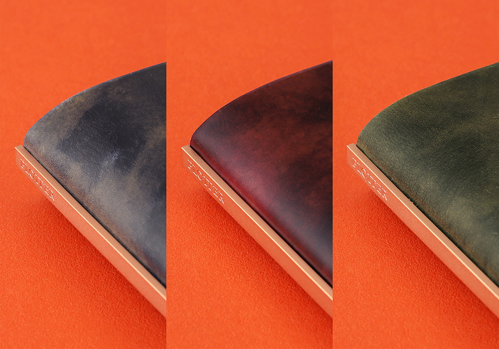 3-Ring Leather Binder in Unevenly Dyed Cordovan in Blue, Wine, and Green.