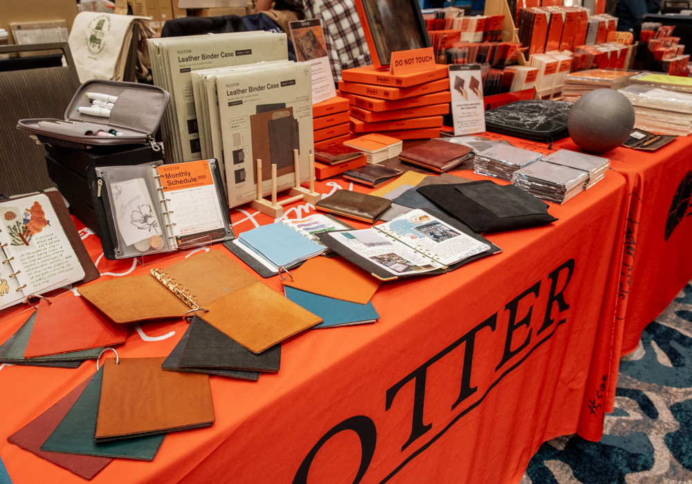 Close up of the PLOTTER USA table at the California Pen Show.