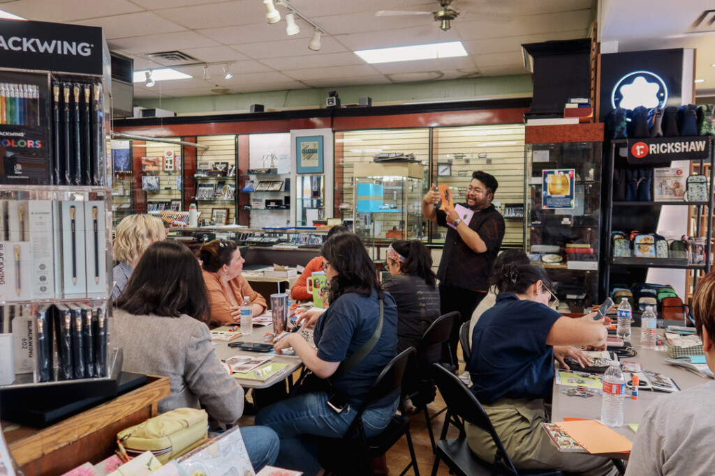 PLOTTER USA staff teaching a workshop about collaging and creating vision boards.
