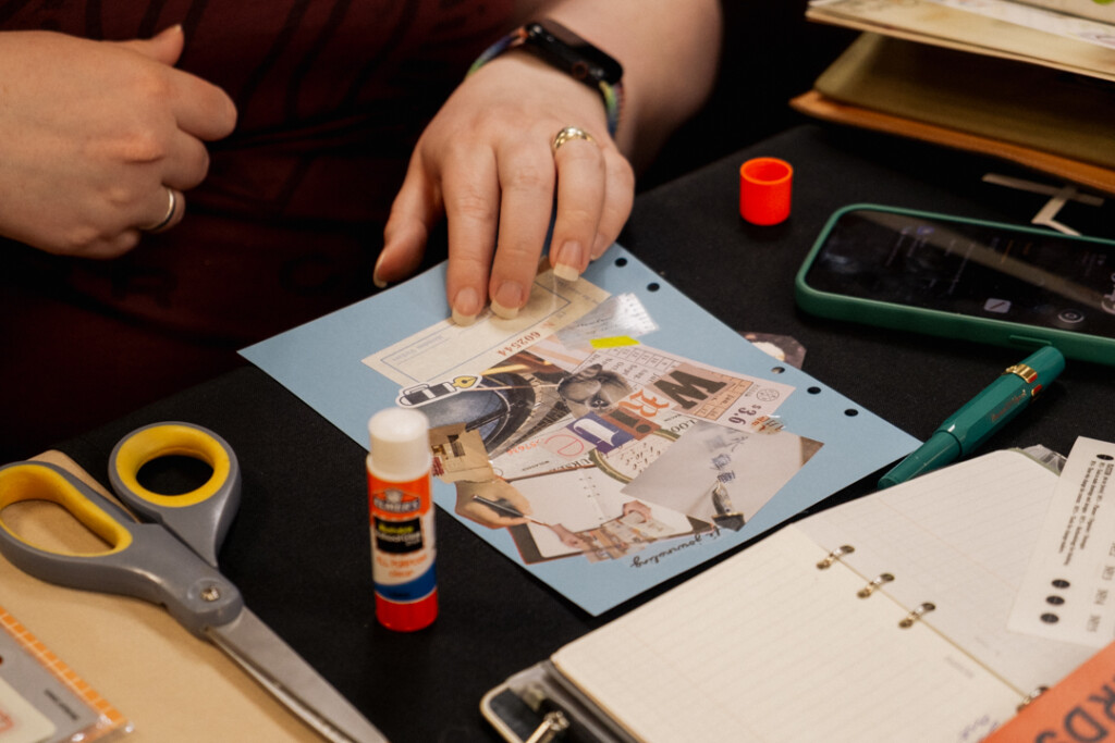 A student who attended the PLOTTER workshop working on their collage vision board.